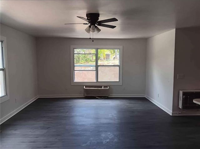 240 Varnes Ln, Lakemont, GA 30552 - empty room featuring heating unit, a wall unit AC, dark wood-type flooring, and a ceiling fan