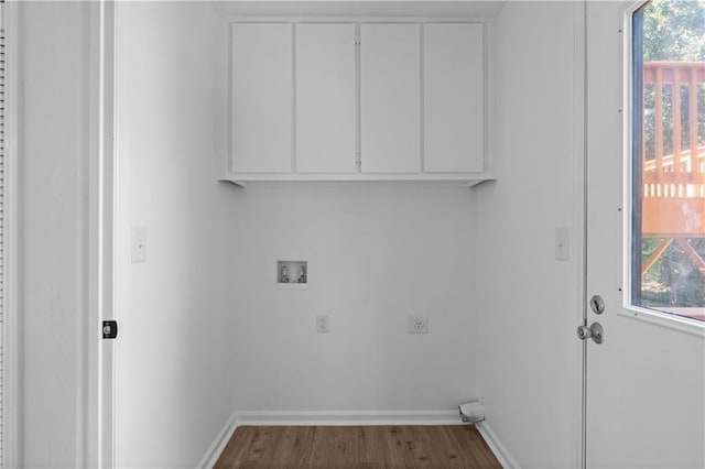 washroom with washer hookup, a wealth of natural light, dark wood-type flooring, and hookup for an electric dryer