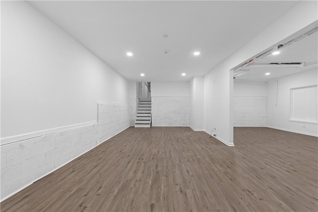 empty room with dark hardwood / wood-style flooring