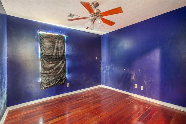 spare room featuring ceiling fan and hardwood / wood-style floors