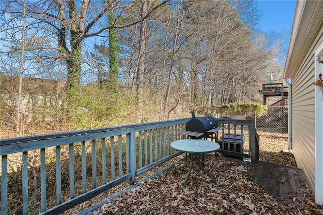 wooden terrace featuring grilling area