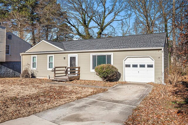 ranch-style house featuring a garage