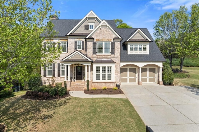 craftsman inspired home with a front lawn, driveway, a shingled roof, and a garage