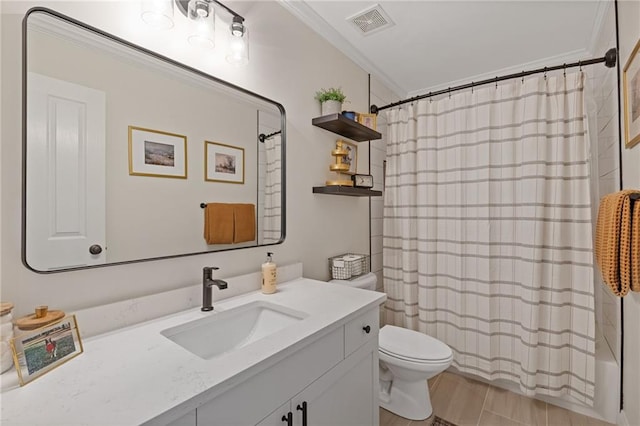 full bath featuring visible vents, toilet, vanity, shower / bath combo with shower curtain, and crown molding
