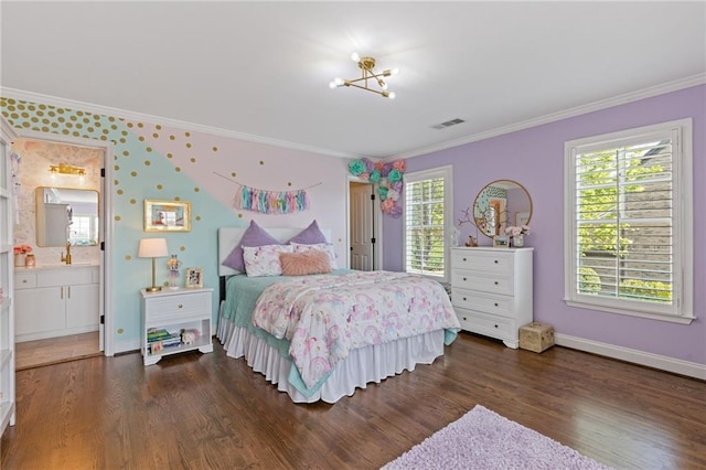 bedroom with wood finished floors, crown molding, and multiple windows