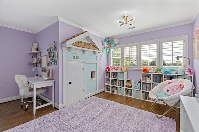 recreation room featuring wood finished floors, visible vents, crown molding, and baseboards