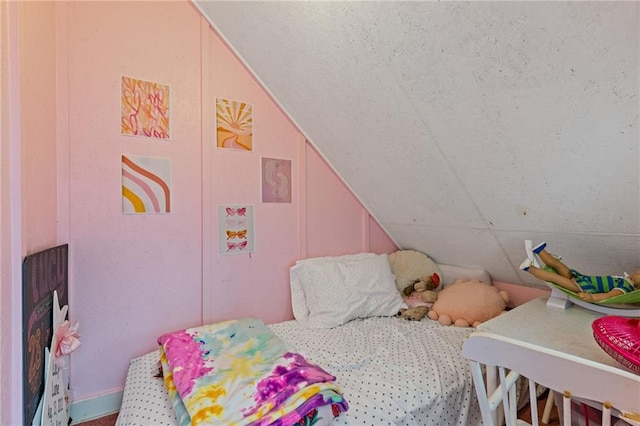 bedroom featuring lofted ceiling