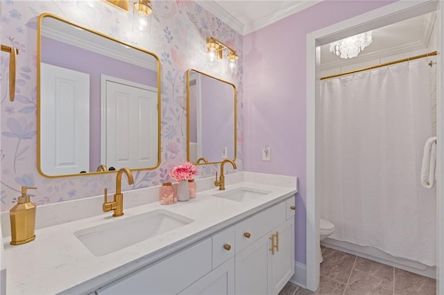 bathroom with wallpapered walls, a sink, double vanity, and toilet
