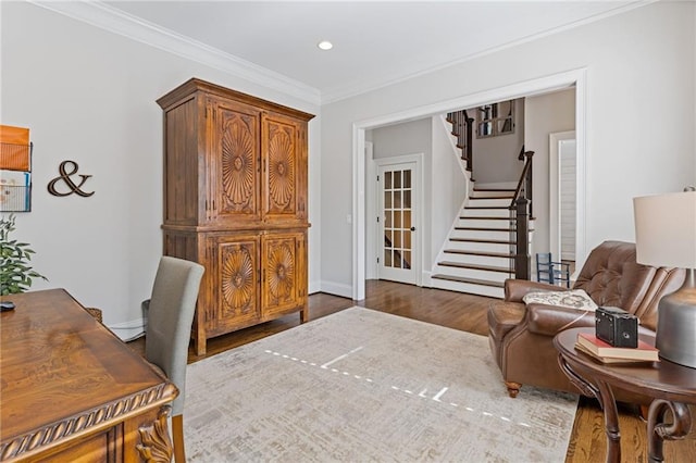 office space with baseboards, wood finished floors, recessed lighting, and crown molding