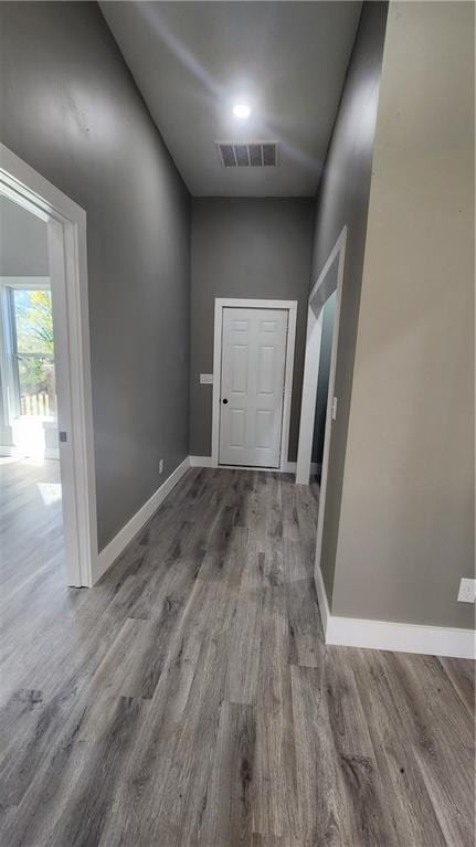 corridor featuring wood-type flooring