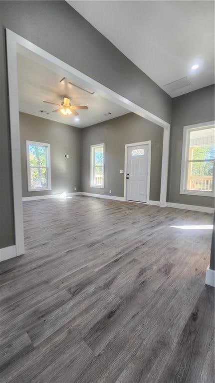 unfurnished living room with ceiling fan and light hardwood / wood-style floors