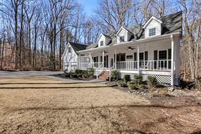 cape cod home featuring ceiling fan and covered porch