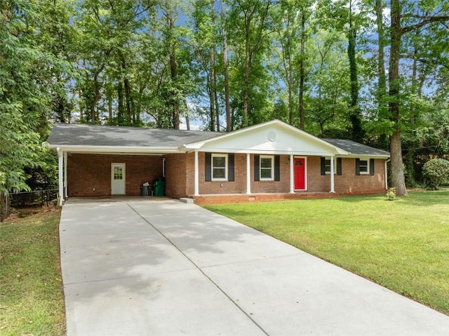 ranch-style house featuring a front lawn, brick siding, driveway, and an attached carport