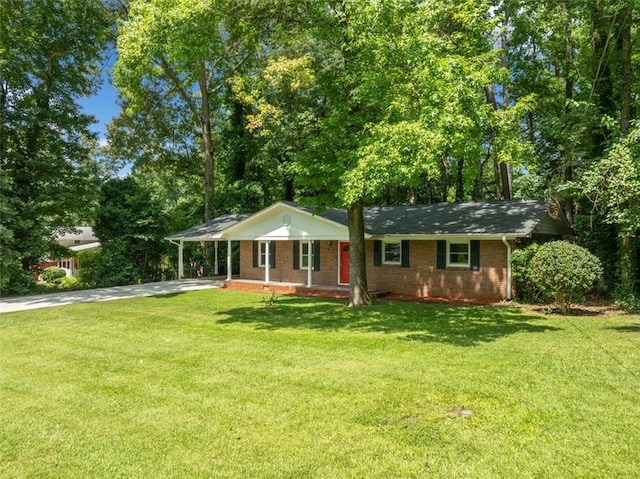 ranch-style house featuring concrete driveway, brick siding, a front lawn, and an attached carport