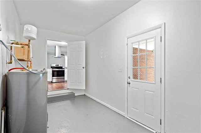 entryway with concrete floors and baseboards