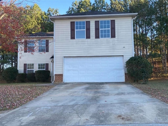 view of front of property with a garage