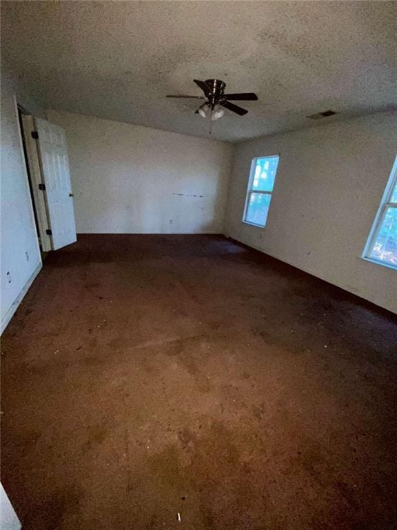 spare room with ceiling fan