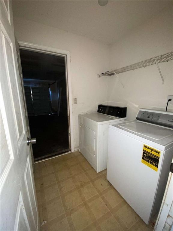 washroom with washer and dryer