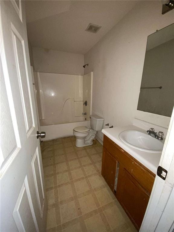 full bathroom featuring  shower combination, vanity, and toilet