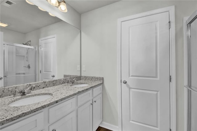 bathroom featuring vanity and walk in shower