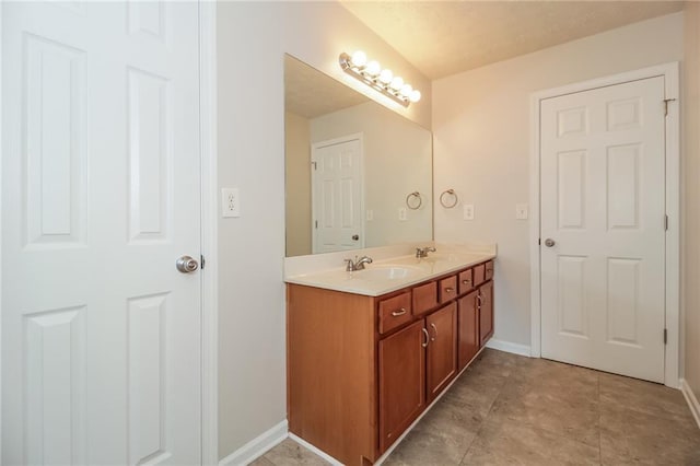 194 Wilhelmina Dr, Austell, GA 30168 - bathroom featuring double vanity and baseboards