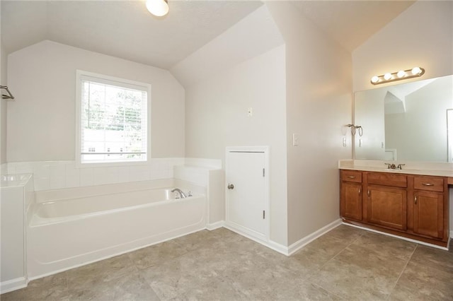 194 Wilhelmina Dr, Austell, GA 30168 - bathroom with lofted ceiling, vanity, and a bath
