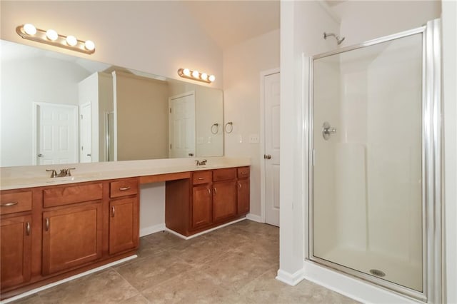194 Wilhelmina Dr, Austell, GA 30168 - bathroom with double vanity, a shower stall, lofted ceiling, and baseboards