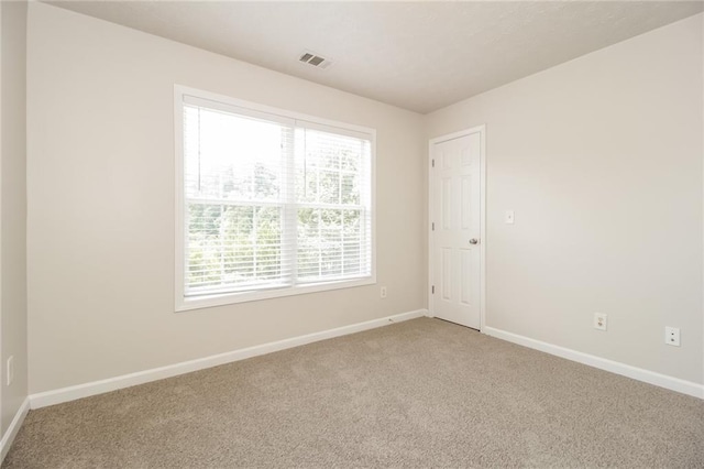 194 Wilhelmina Dr, Austell, GA 30168 - spare room featuring plenty of natural light, baseboards, and light carpet