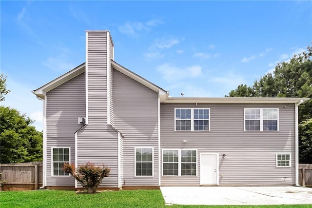 194 Wilhelmina Dr, Austell, GA 30168 - rear view of house featuring a patio area and a chimney