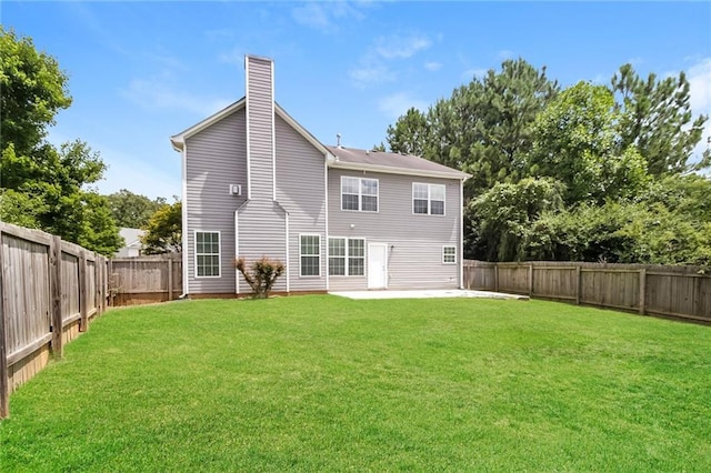 194 Wilhelmina Dr, Austell, GA 30168 - back of house with a patio area and a chimney