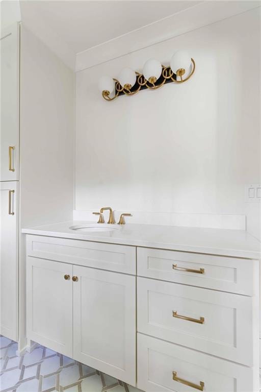 bathroom featuring tile patterned floors and a sink