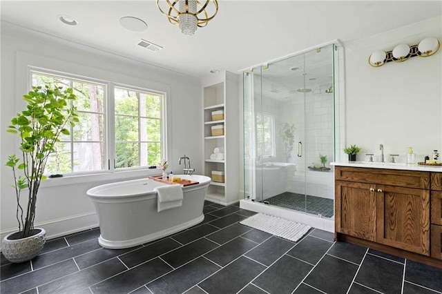 full bathroom featuring plenty of natural light, visible vents, a shower stall, and a freestanding tub