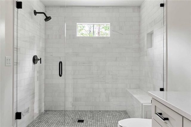 full bath featuring toilet and a shower stall
