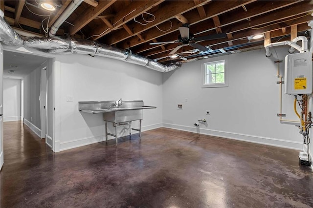 basement with baseboards and water heater