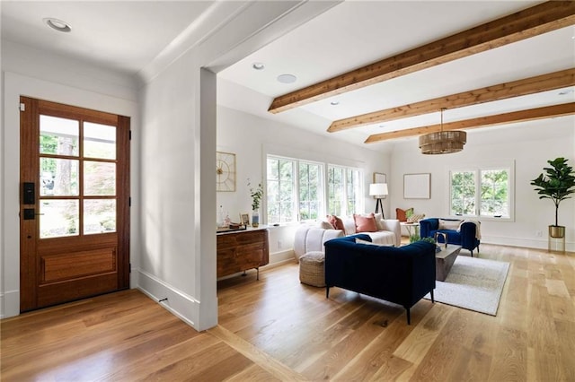 living room with baseboards, beamed ceiling, light wood finished floors, and recessed lighting
