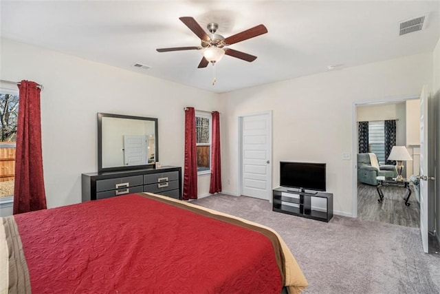 carpeted bedroom with ceiling fan