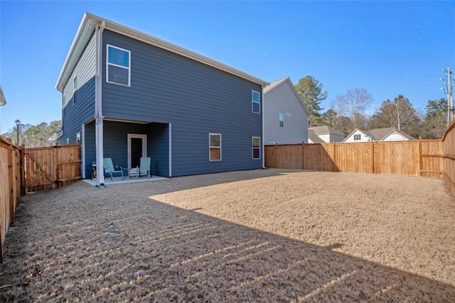 rear view of property with a patio area