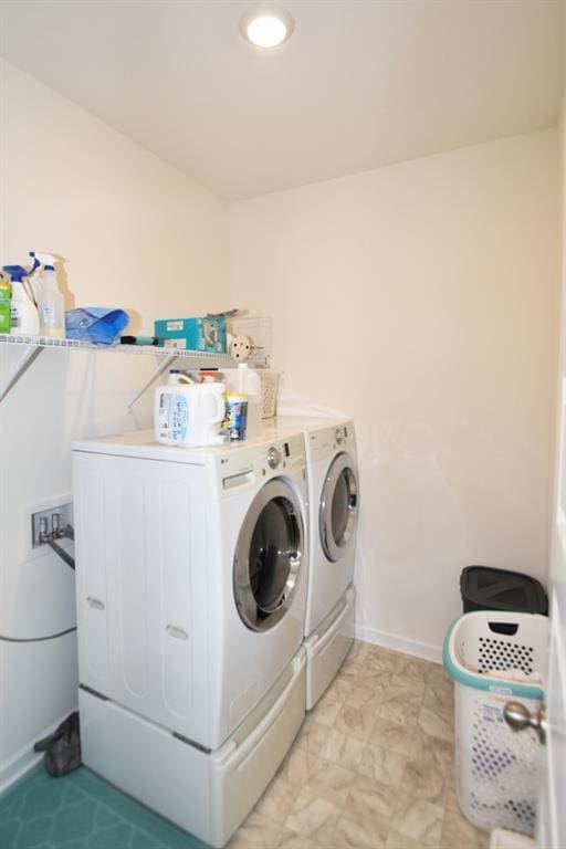 laundry area with separate washer and dryer