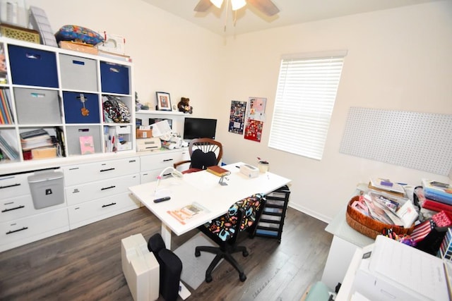 home office with ceiling fan and dark hardwood / wood-style flooring