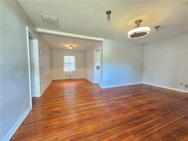 unfurnished room featuring hardwood / wood-style floors