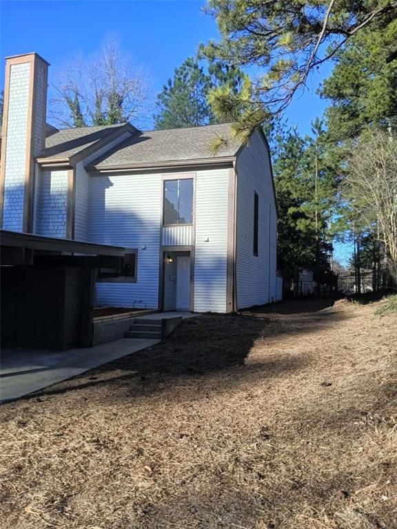 exterior space featuring a chimney