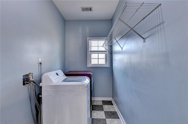 clothes washing area featuring laundry area, baseboards, visible vents, tile patterned floors, and washing machine and clothes dryer