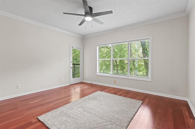 unfurnished room featuring a textured ceiling, dark hardwood / wood-style floors, and ornamental molding