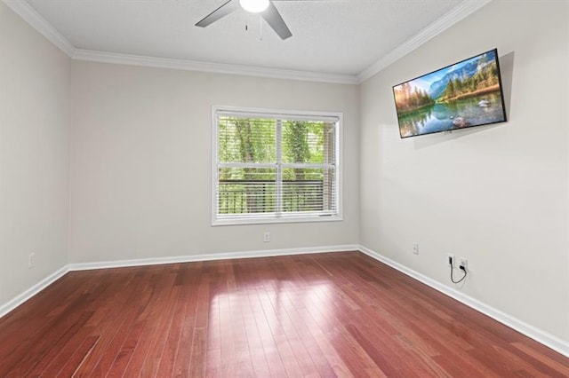 spare room with crown molding, ceiling fan, and hardwood / wood-style flooring