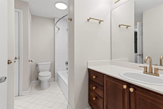 full bathroom with vanity, tiled shower / bath, tile patterned flooring, toilet, and a textured ceiling