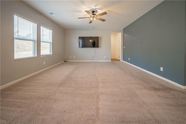 unfurnished living room featuring carpet and ceiling fan