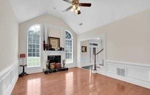 workout area with lofted ceiling, hardwood / wood-style floors, and ceiling fan