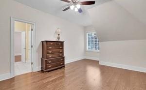 bonus room with ceiling fan, wood-type flooring, and vaulted ceiling