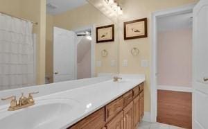 bathroom featuring vanity, tile patterned flooring, and a shower with shower curtain