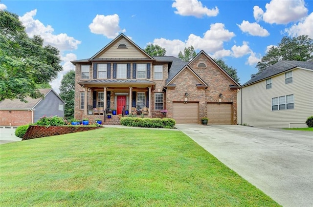 2612 Back Creek Chase, Dacula, GA 30019 - view of front of house featuring a porch, concrete driveway, a front yard, brick siding, and a garage